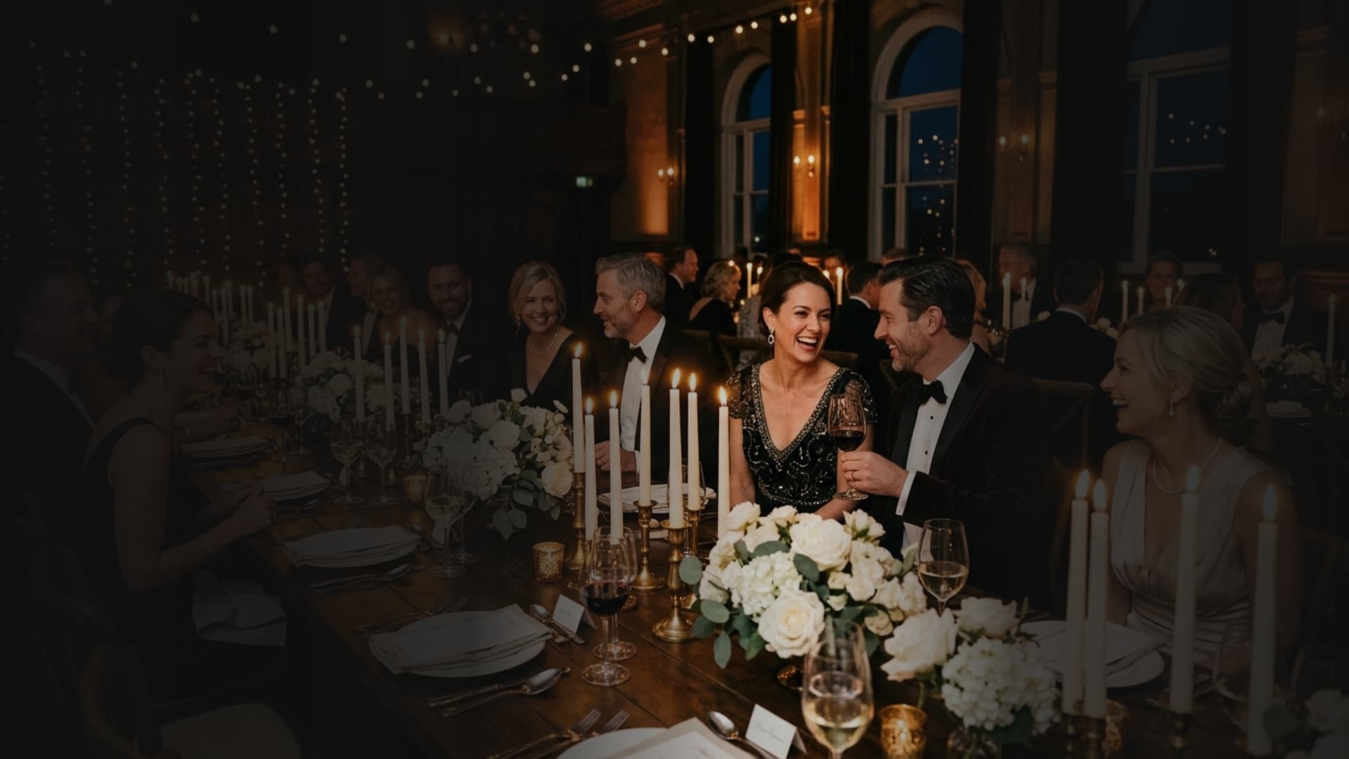 Candlelit banquet dinner with elegant guests gathering